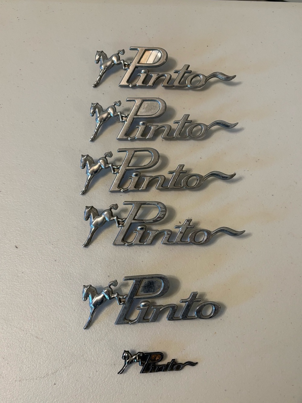 Vintage Chrome Ford Pinto Fender Emblem - Silver Finish set/6